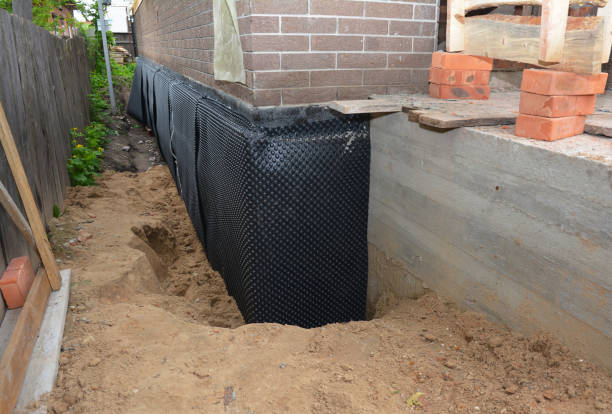 Happy homeowners after waterproofing job in Middleville
